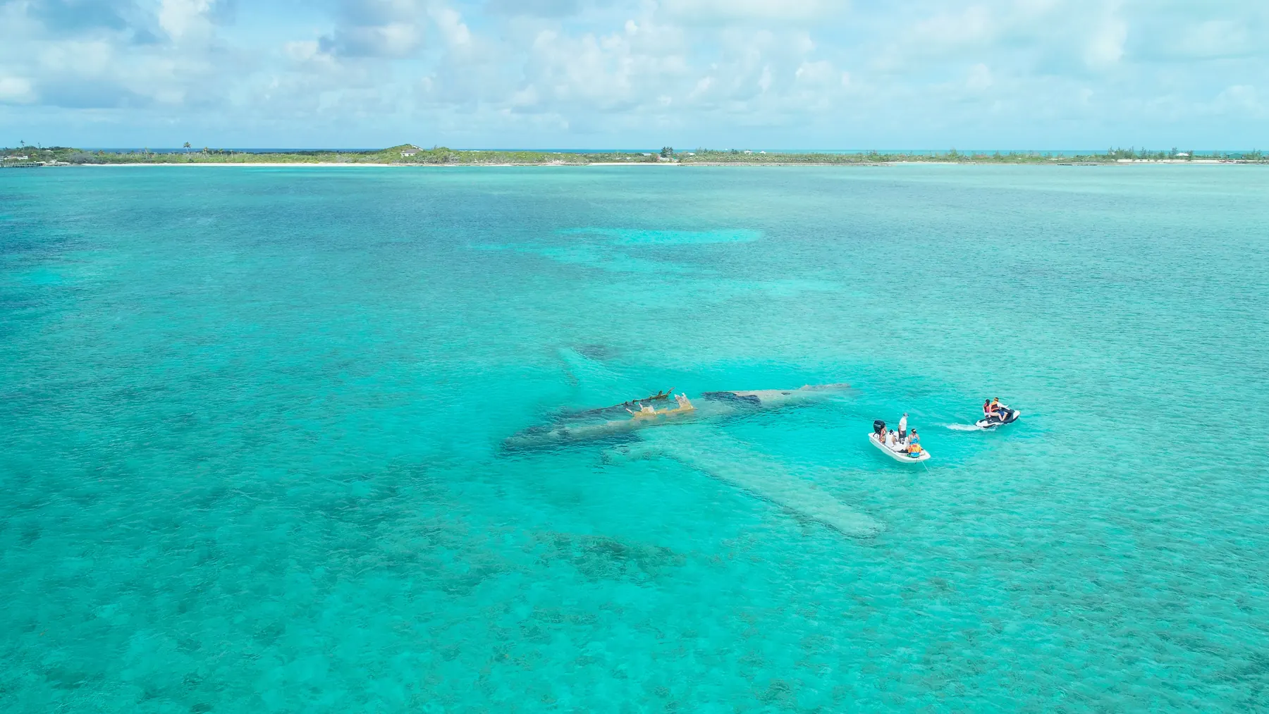 The sunken drug plane wreck in the shallows off Normans Cay, Exuma Bahamas